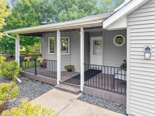 Large front porch. Nicely landscaped yard and mature trees.