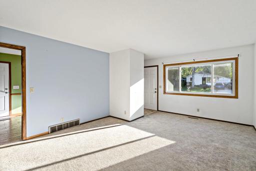 Natural light pours through the large picture window.