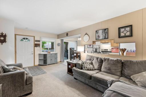 Comfortable living room with opening into kitchen.