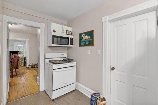 Kitchen and two bedrooms on the main level of the upper unit.