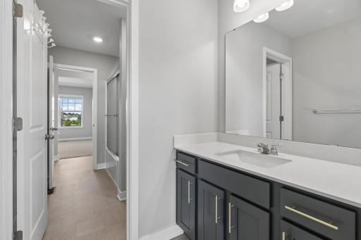 Jack and Jill bathroom with vanity on EACH side of the adjoining rooms.