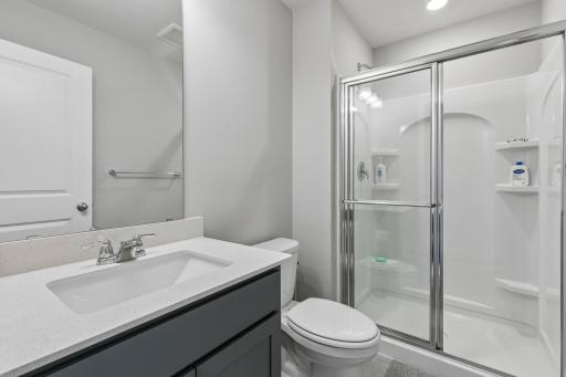 Upper 3/4 bath across from bedroom #4 (with large linen closet outside door).