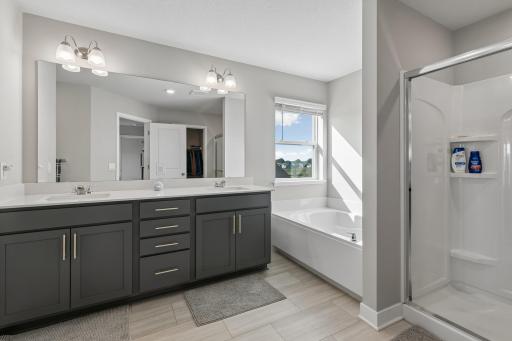 Primary bathroom with soaking tub and 3/4 shower.
