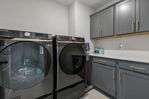 Upper level laundry room with plenty of storage.