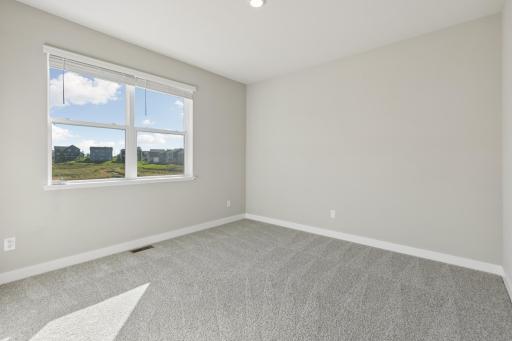 MAIN level bedroom #1. Overlooking the beautiful back yard.