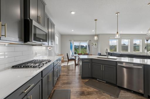 Gas stovetop with under cabinet lighting.