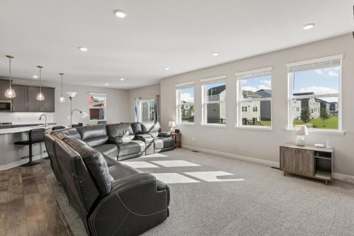 Full view of living room--overlooking back yard and pond.