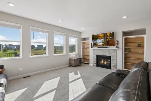 Main level family room with cozy gas fireplace.