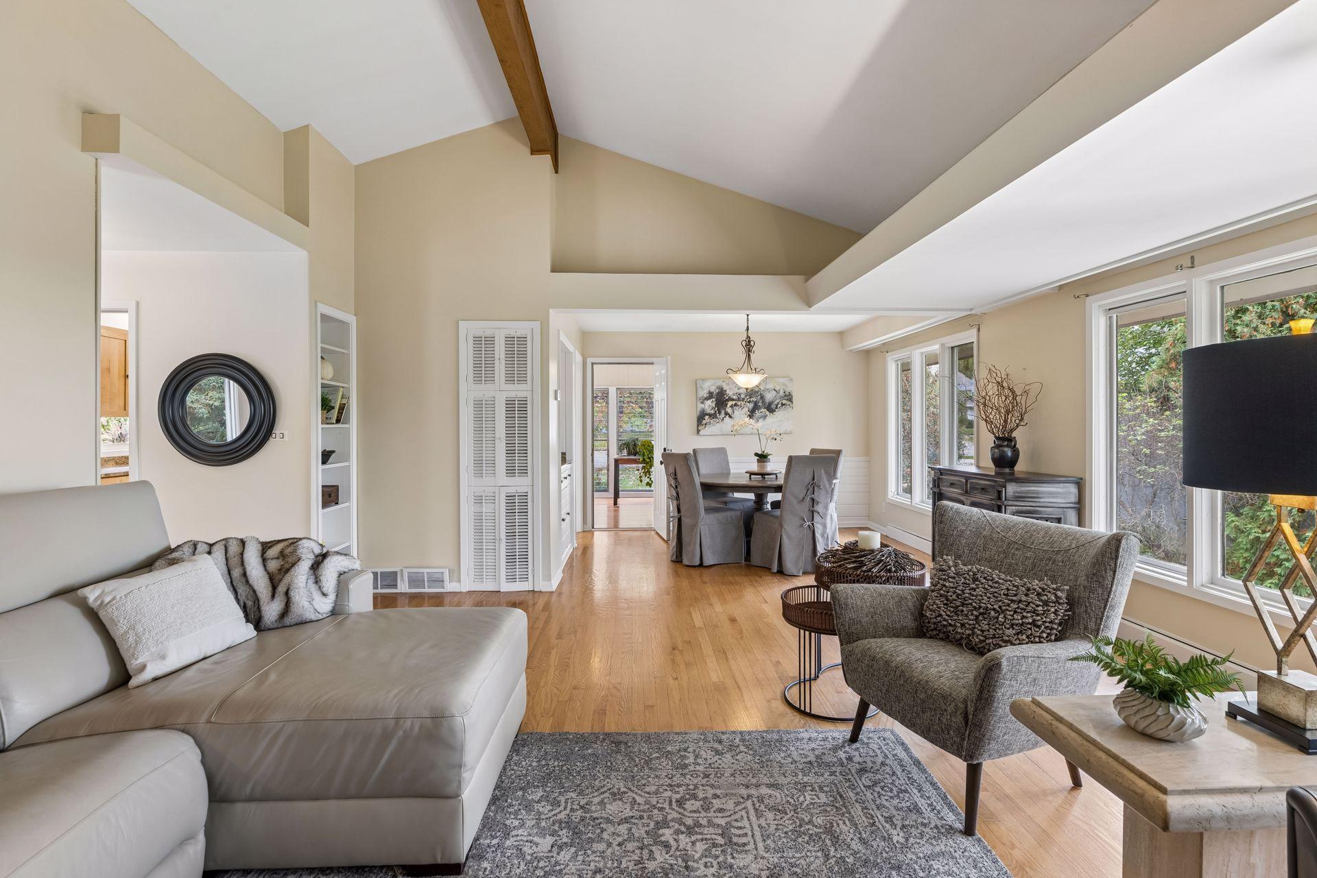 The living room flows seamlessly into the formal dining room