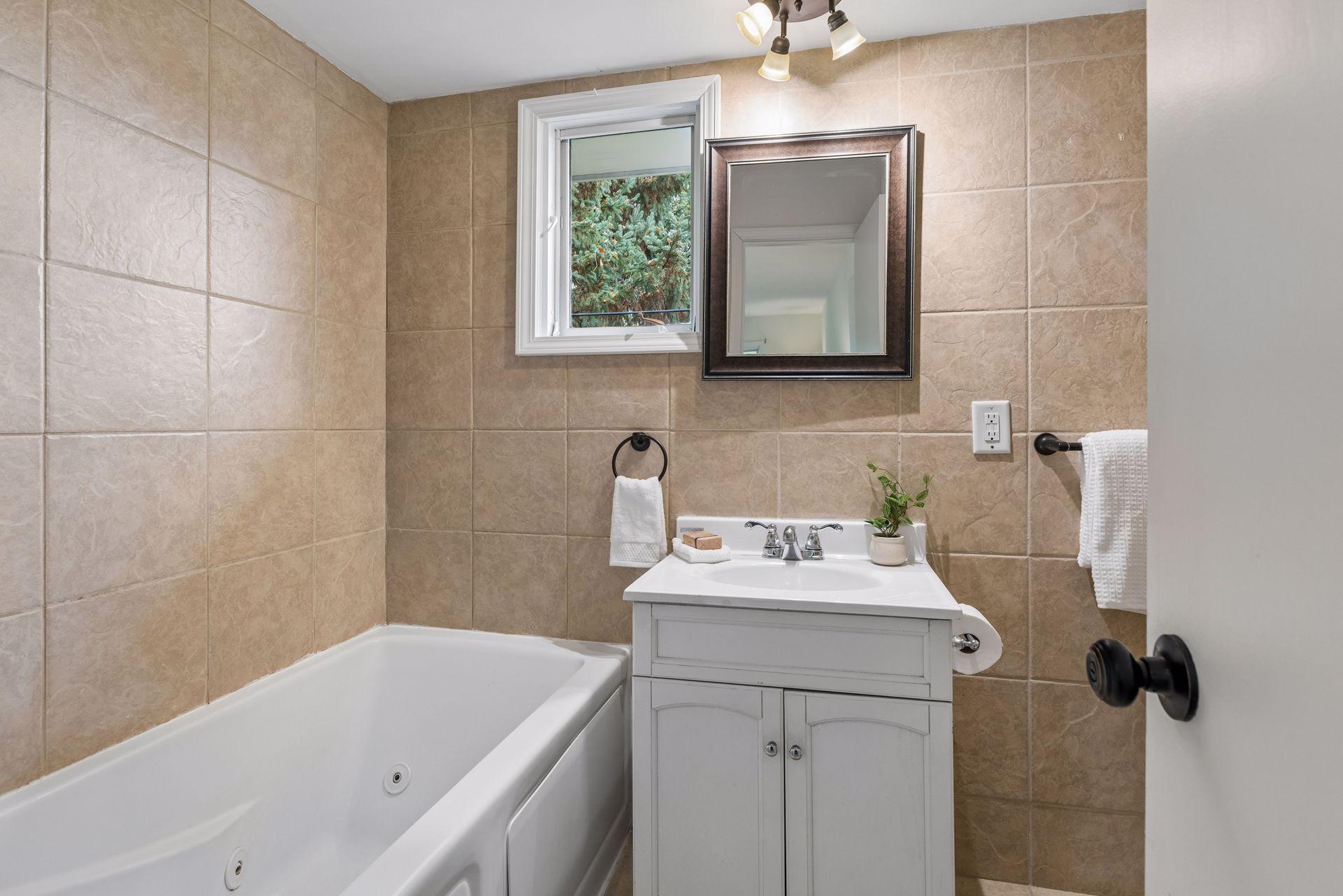 Nicely appointed primary ensuite with jacuzzi tub