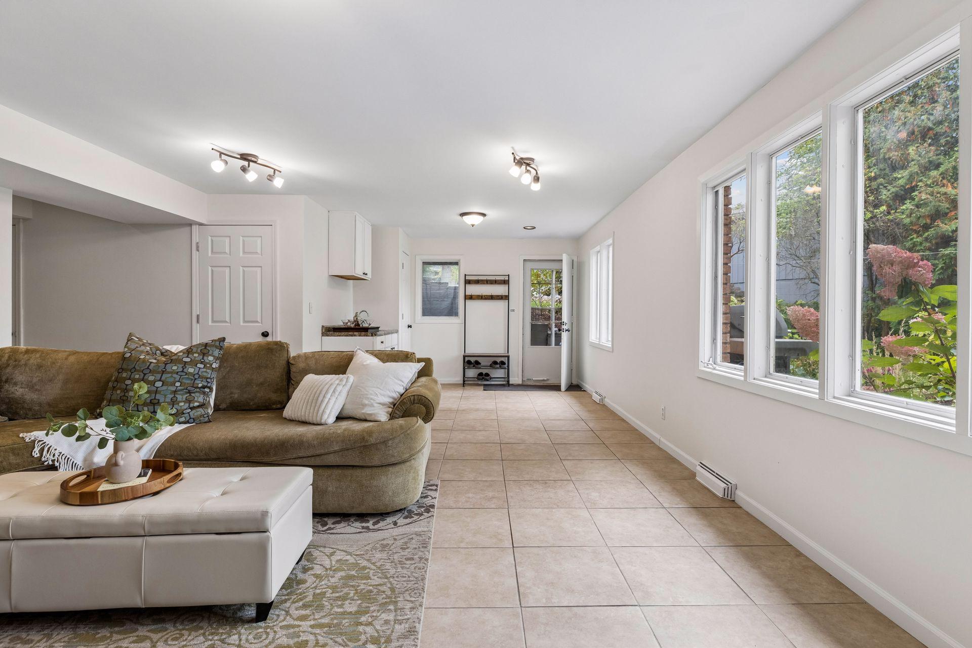 Lower level family room walks out to private backyard and more beautiful places to gather and relax