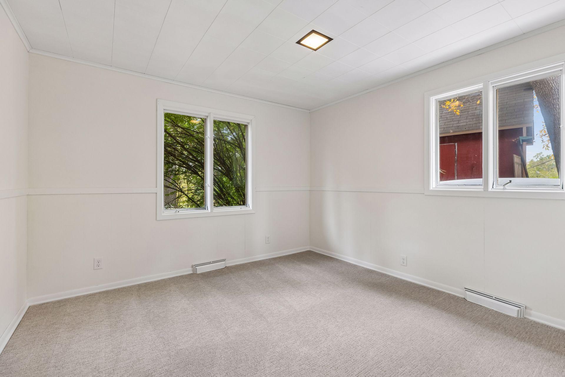Bedroom 4 in lower level, freshly painted with new carpet