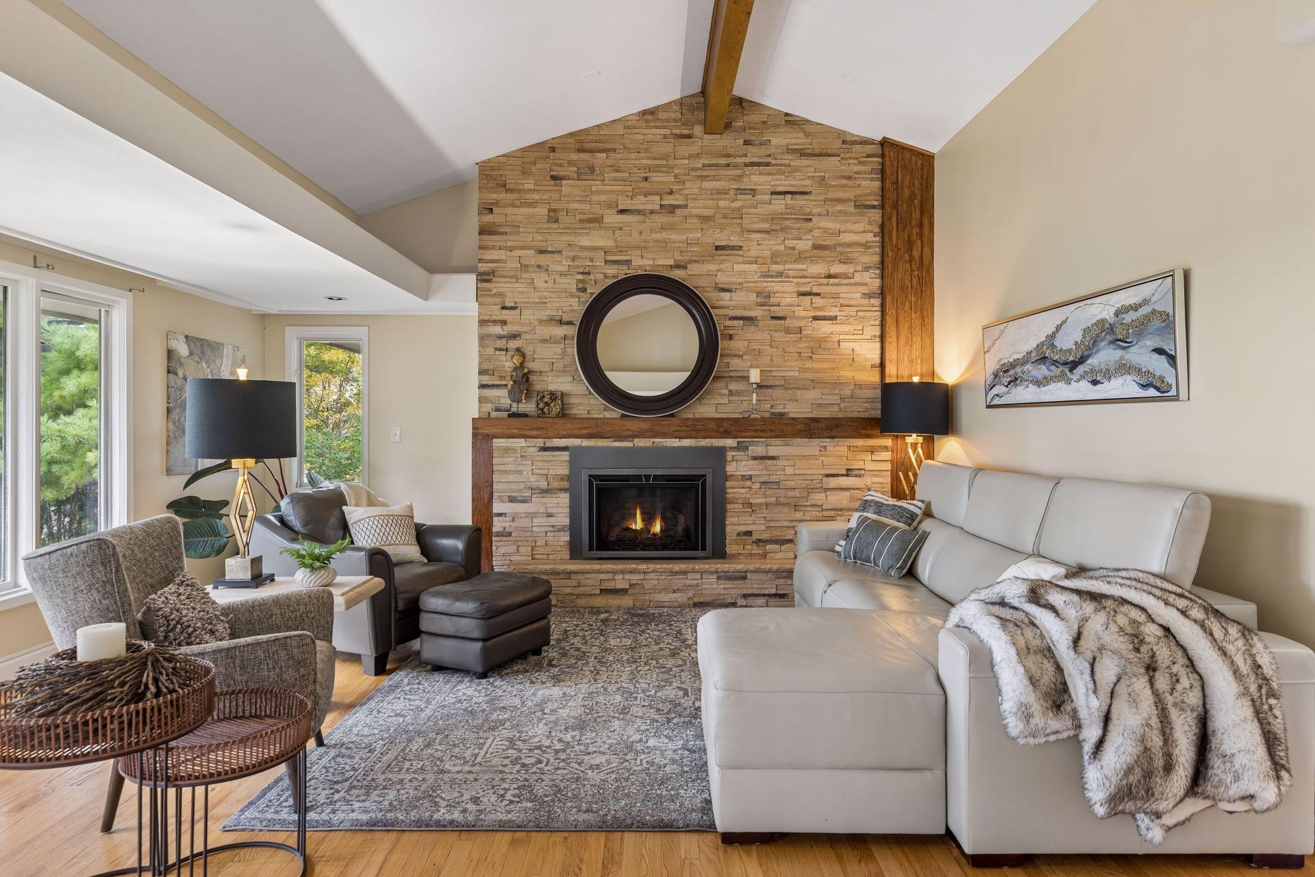 Beautiful brick fireplace is focal point of main level living room