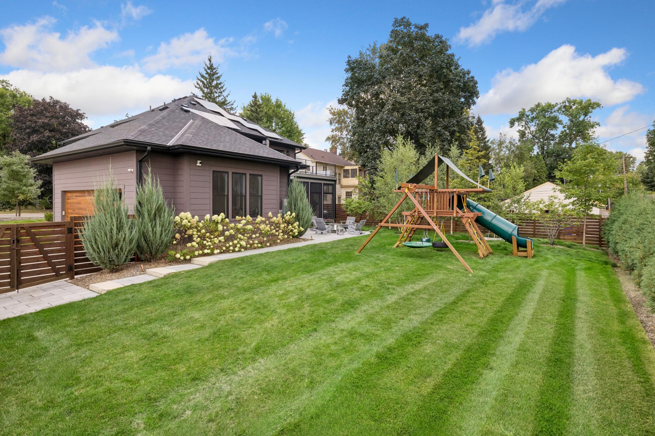 Beautifully landscaped backyard with privacy fencing.