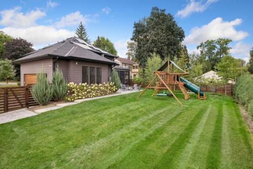 Beautifully landscaped backyard with privacy fencing.