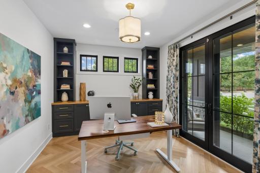 Light-filled front office with custom built-ins & French doors to the porch.