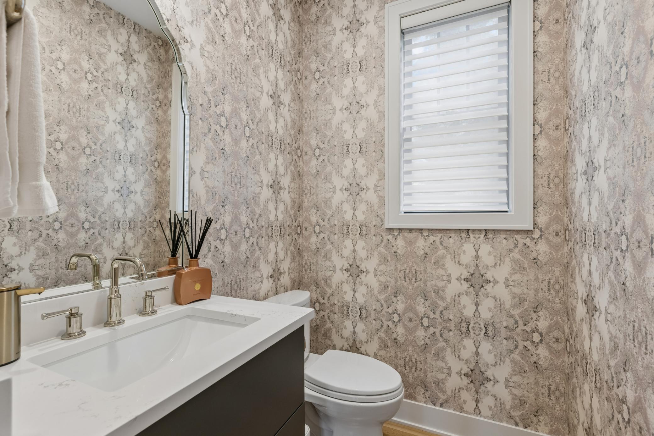 Beautifully finished main-level half bath.