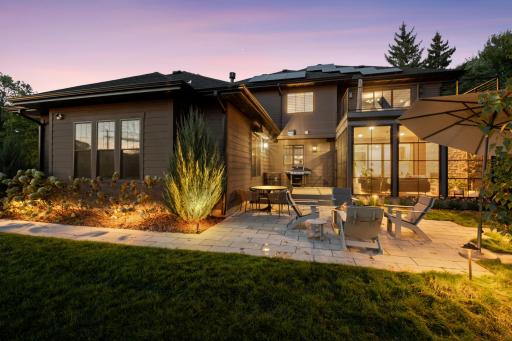Beautifully landscaped backyard with privacy fencing & landscape lighting.