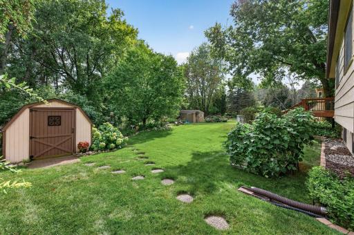 Storage shed included in backyard.