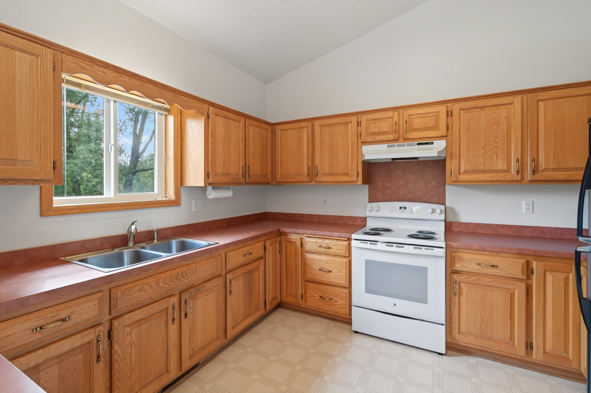 Warm Oak Cabinetry with Plenty of Kitchen Storage