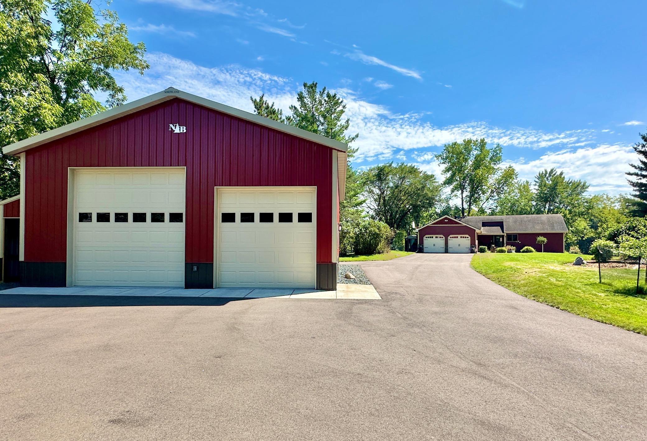 This fantastic shop and all the black top was just added 3 years ago. Shop has concrete, full electric including 220, is finished in tin inside and is heated with a gas heater.
