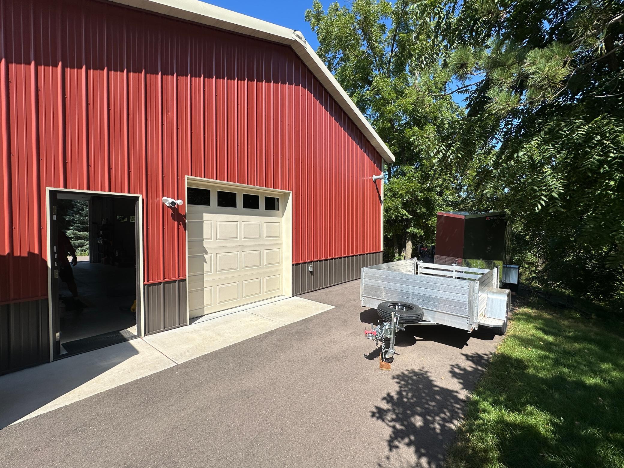 The shop has two service doors and 3 over head doors all different sizes.