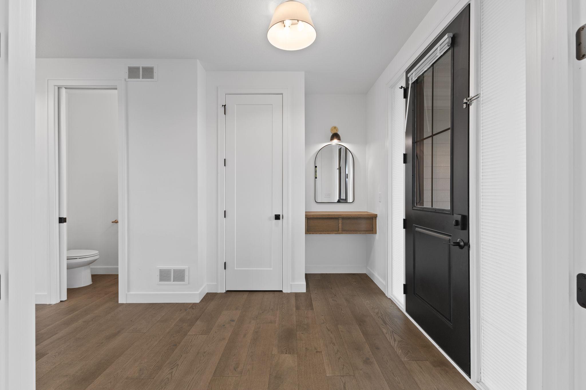A convenient drop zone near the entry adds everyday function without sacrificing style.