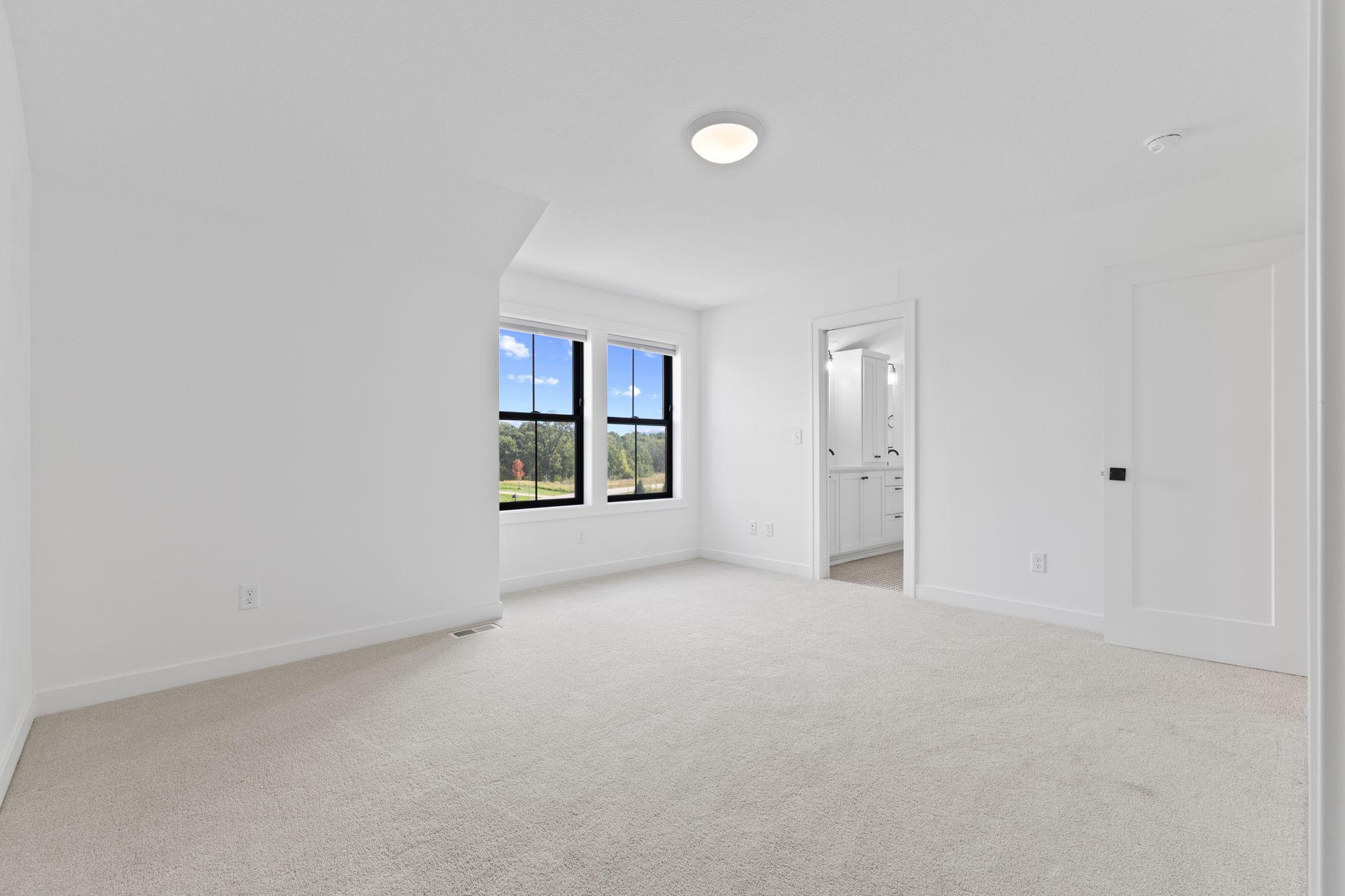 Another generously sized upper-level bedroom with direct access to the Jack-and-Jill bath.