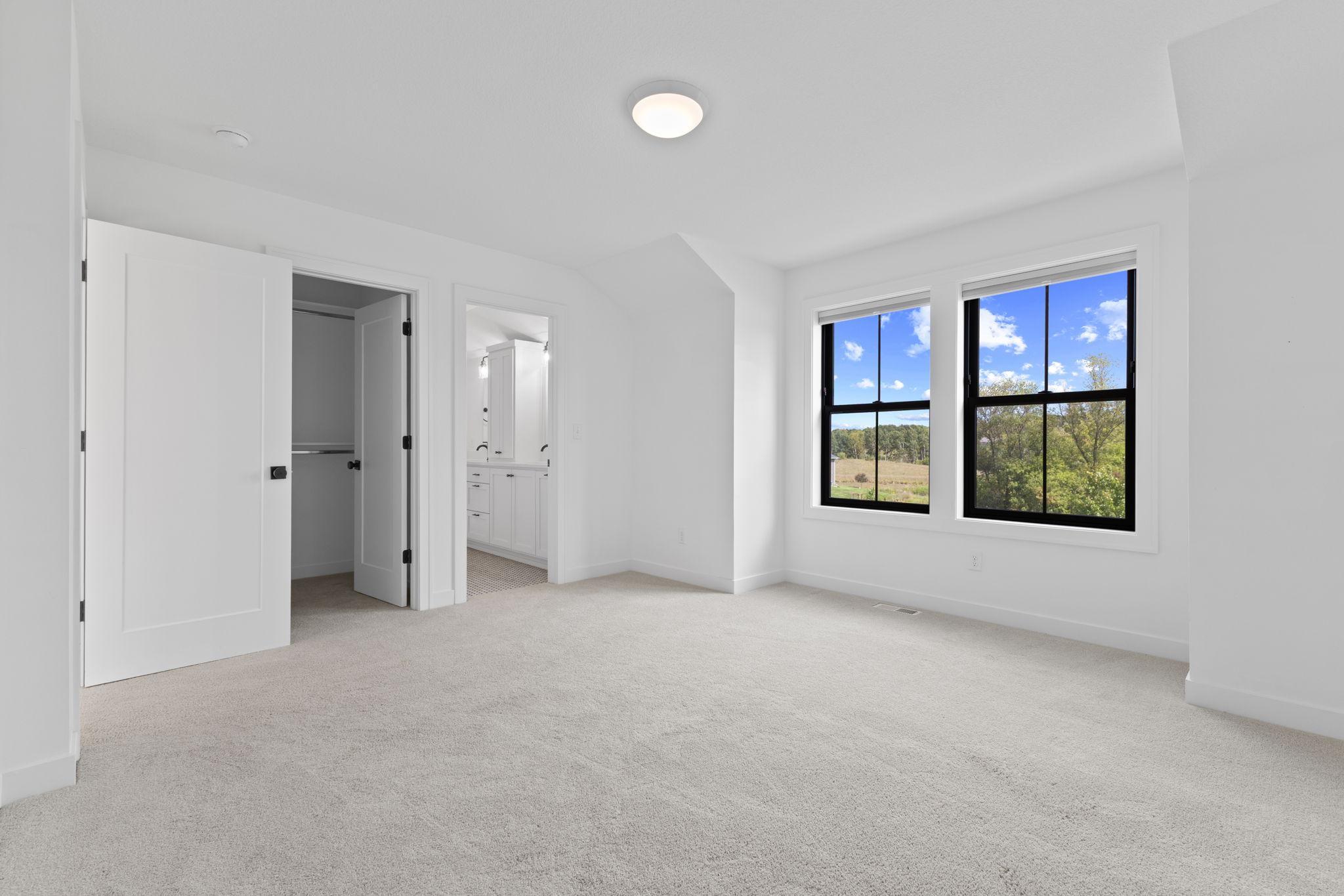 Two of the upper-level bedrooms are connected by a convenient Jack-and-Jill bathroom.