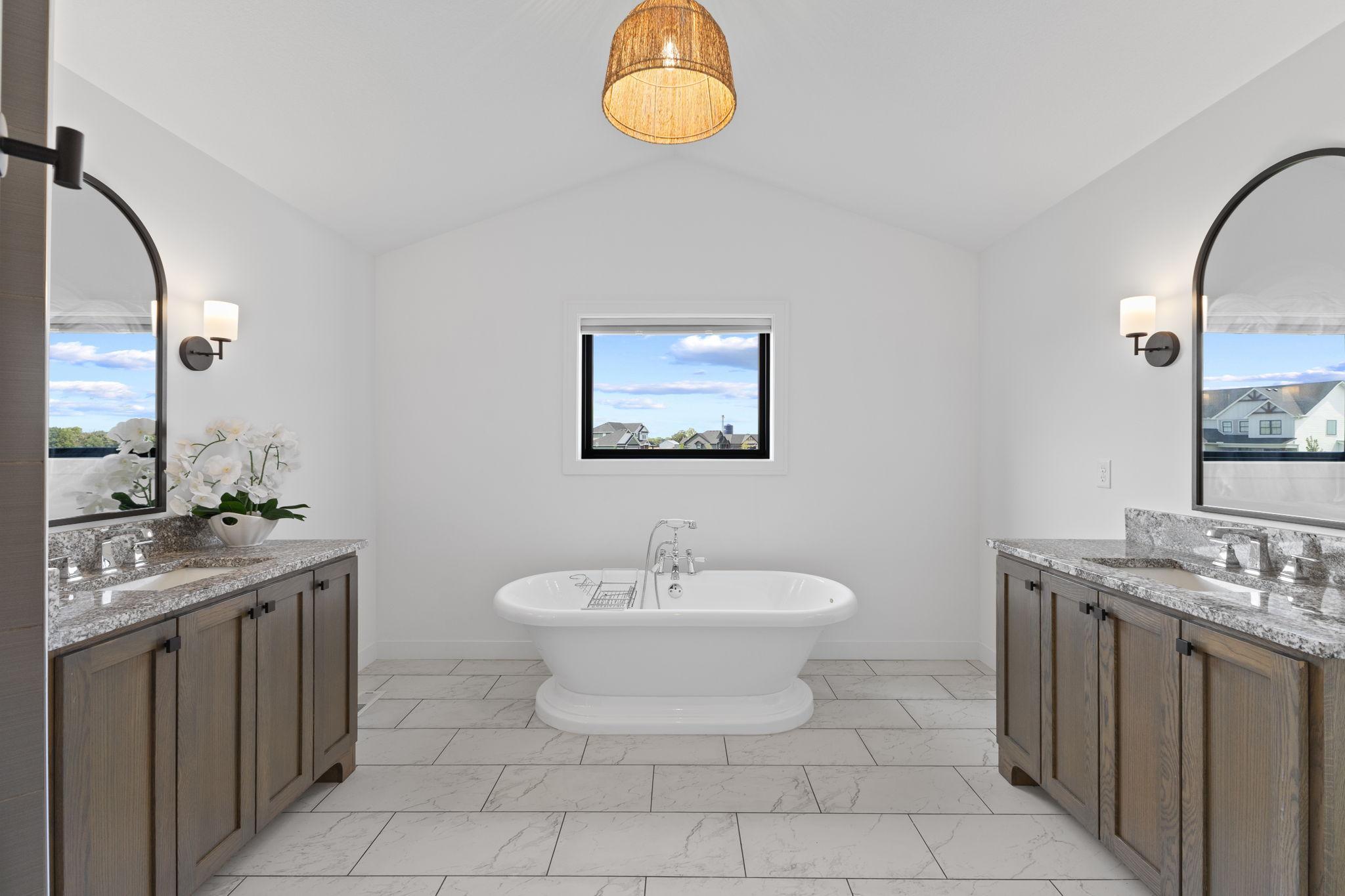 Unwind at the end of the day in the beautiful freestanding tub, complete with heated tile floors underfoot.