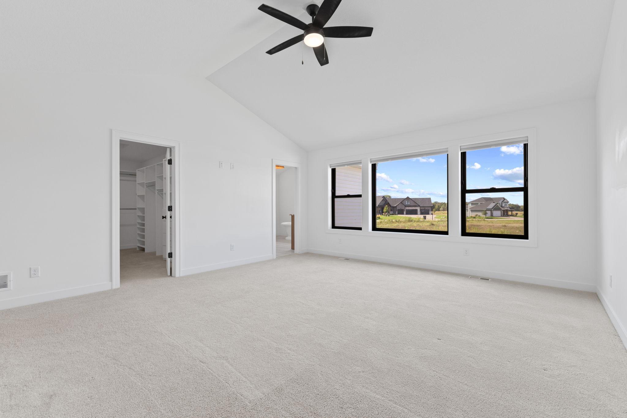 The expansive primary suite offers plenty of room to create a comfortable retreat.