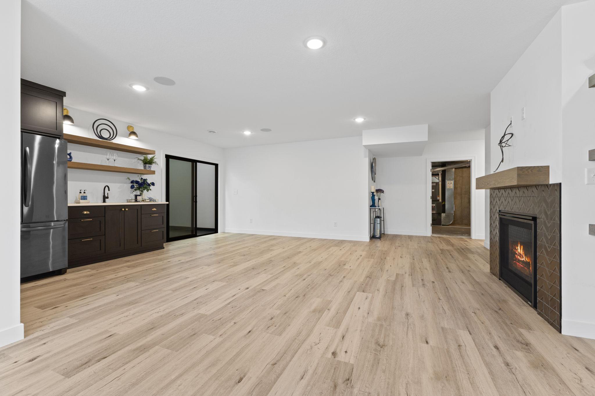 The spacious lower-level family room leaves plenty of flexibility for multiple entertaining areas.