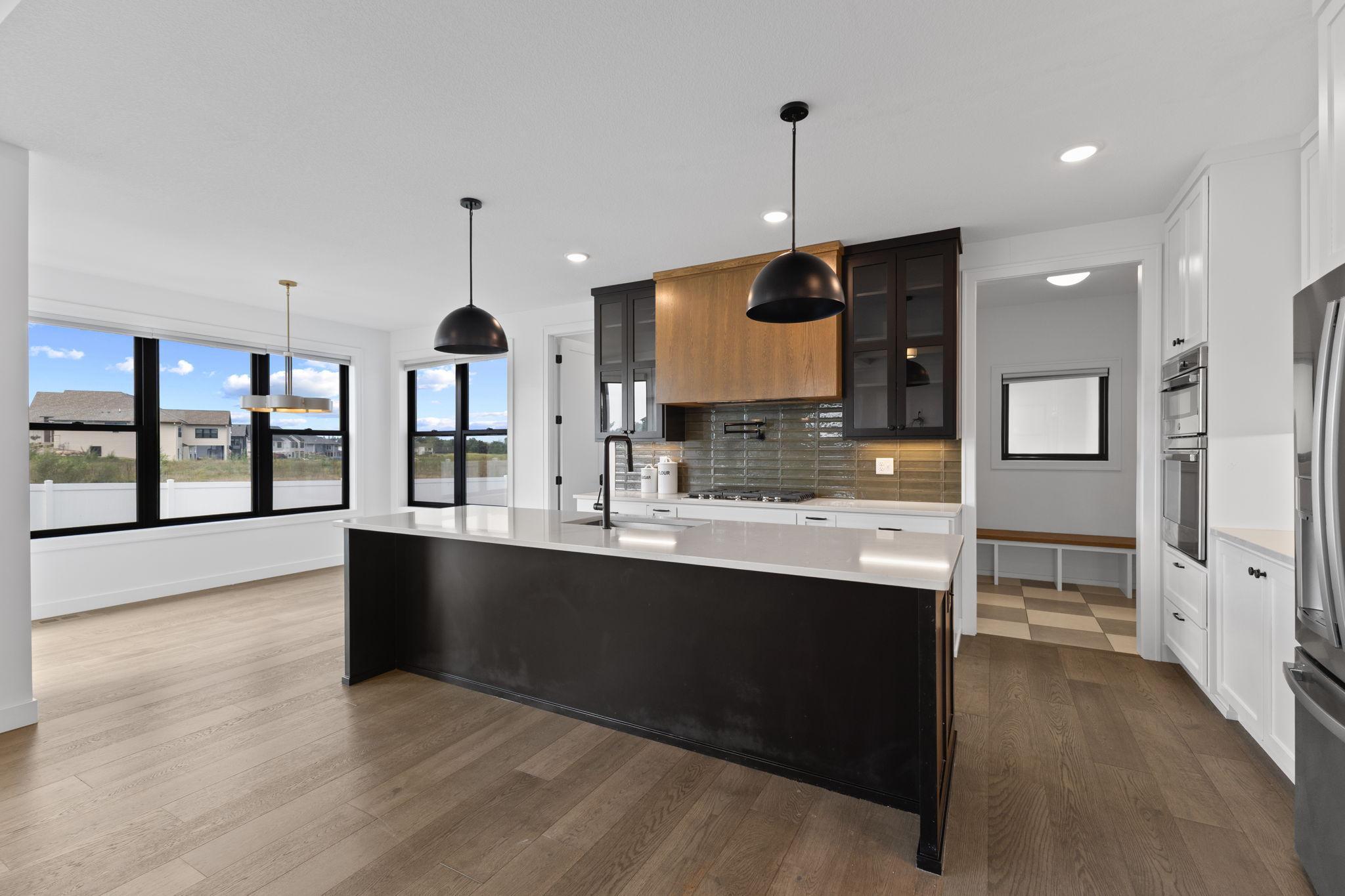The oversized center island provides abundant prep space along with room for casual seating.
