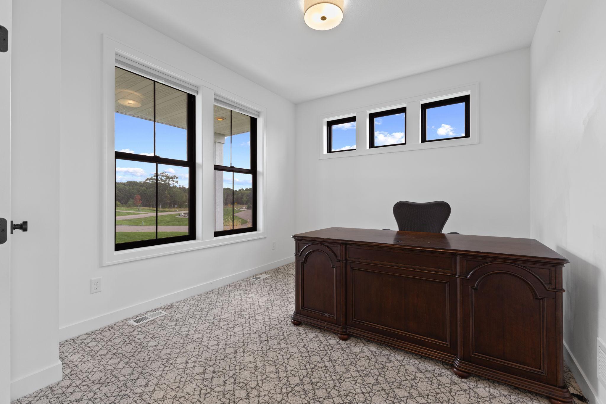 Large windows bring plenty of natural light into this versatile room.