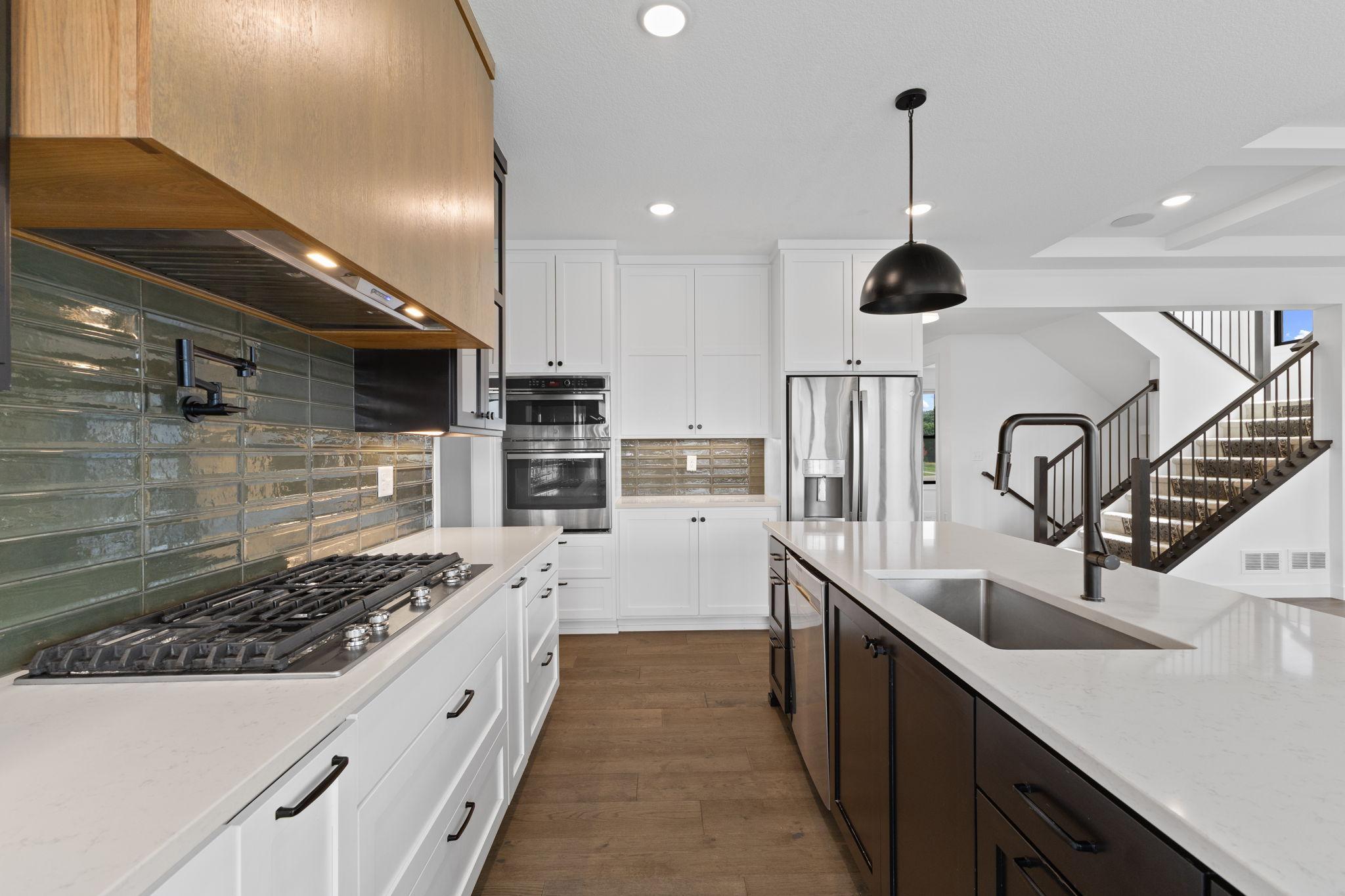 Thoughtfully designed cabinetry provides plenty of storage throughout this impressive kitchen.
