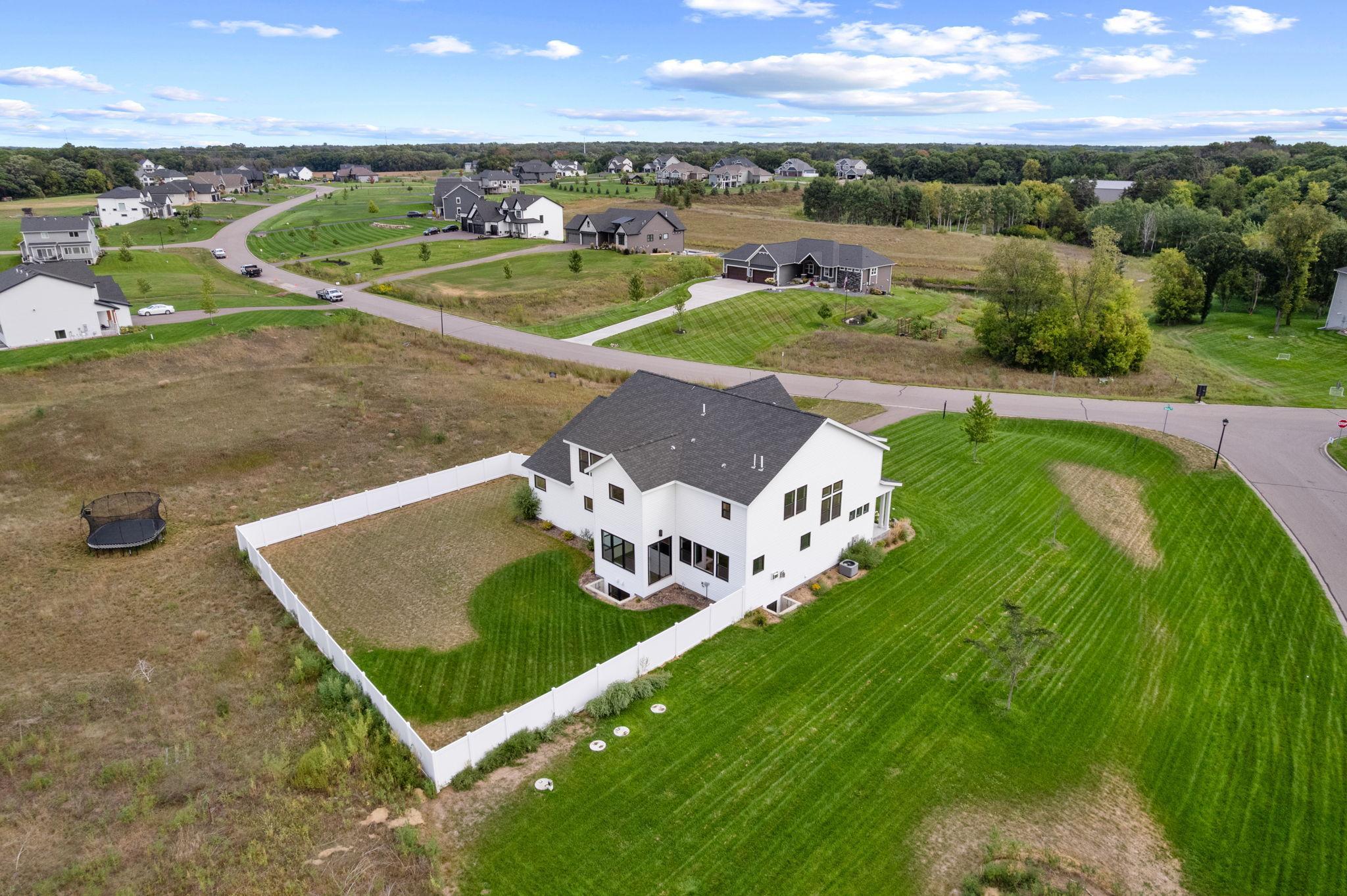 Plenty of open green space surrounds the home, offering room to play, entertain or simply enjoy being outside.