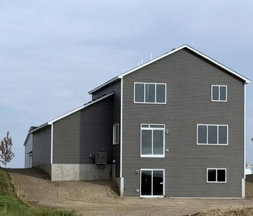 3135 Jandura Ave NE- Rear elevation features a Walkout Lower Level to a spacious backyard! Sod and Irrigation System will be installed soon.