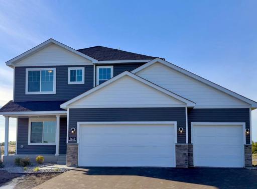 3135 Jandura Ave NE- New Construction Home ready for a Quick Move-in! Highlights include a 4 Bay Garage (934 sq. ft.) and Front Porch located on a Walkout Homesite! Sod, Irrigation System, & Front Plantings included.