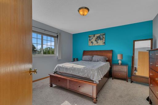 Primary Bedroom With Views Of The Tree Tops!