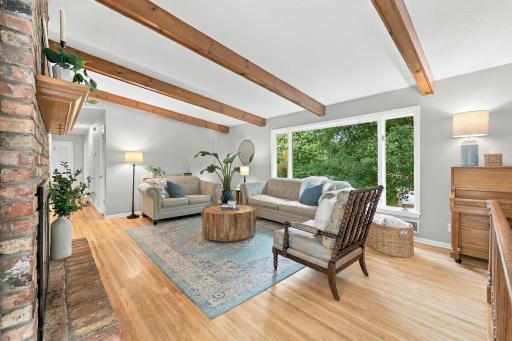Living Area with Wood Burning Fireplace/Hardwood Floors