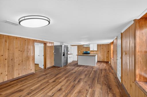 Another view of the lower level space which is generous in size. Remember you cannot rent this out as two units however you can have a friend of family live with you in a separate unit.