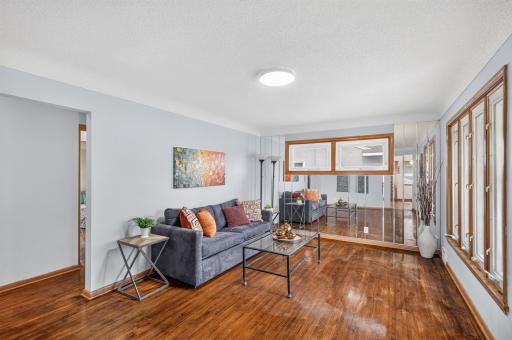 You will notice upon entry the gleaming hardwood floors...