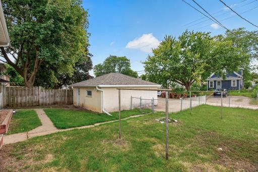 Two stall garage with extra parking and concrete drive.