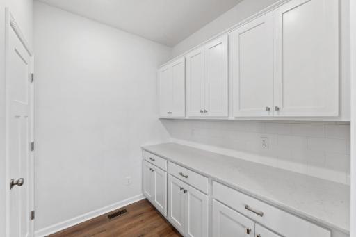 The butler's pantry is an ideal space for added meal preparation and kitchen organization.