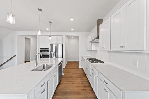 The large center island provides true eat in capabilities to go along with handy storage.