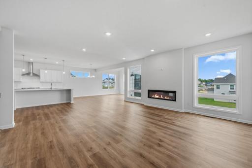 The family room is spacious and has large windows to allow natural light to pour into the home.