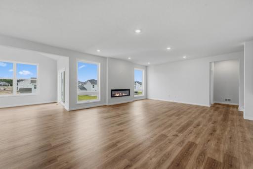 Additional view of the family room with the cozy fireplace.