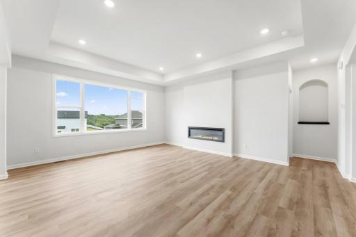 This family room has a beautiful view to the backyard.