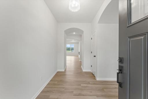 Beautiful arched walkway as you enter this main level living home.