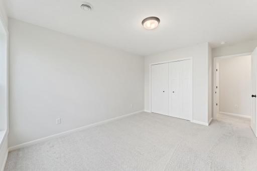 Alternative view of bedroom, featuring closet.